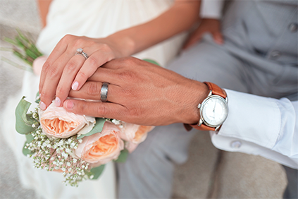 Close-up of a wedding ring exchange at a luxury Orlando Wedding Villa holiday rental.